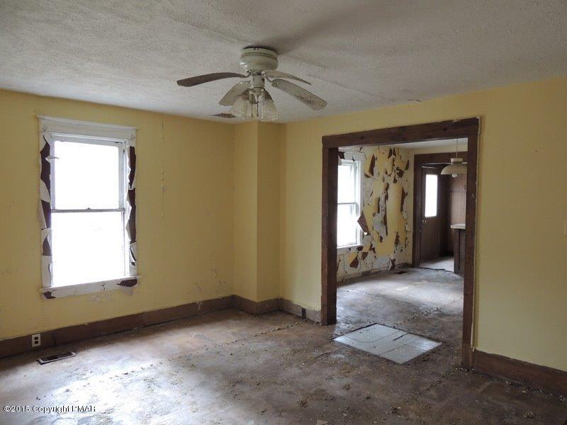 2800 Locust Ridge Road Pocono Lake, PA 18347 - Photo 6 of 20 an empty room with windows and fan