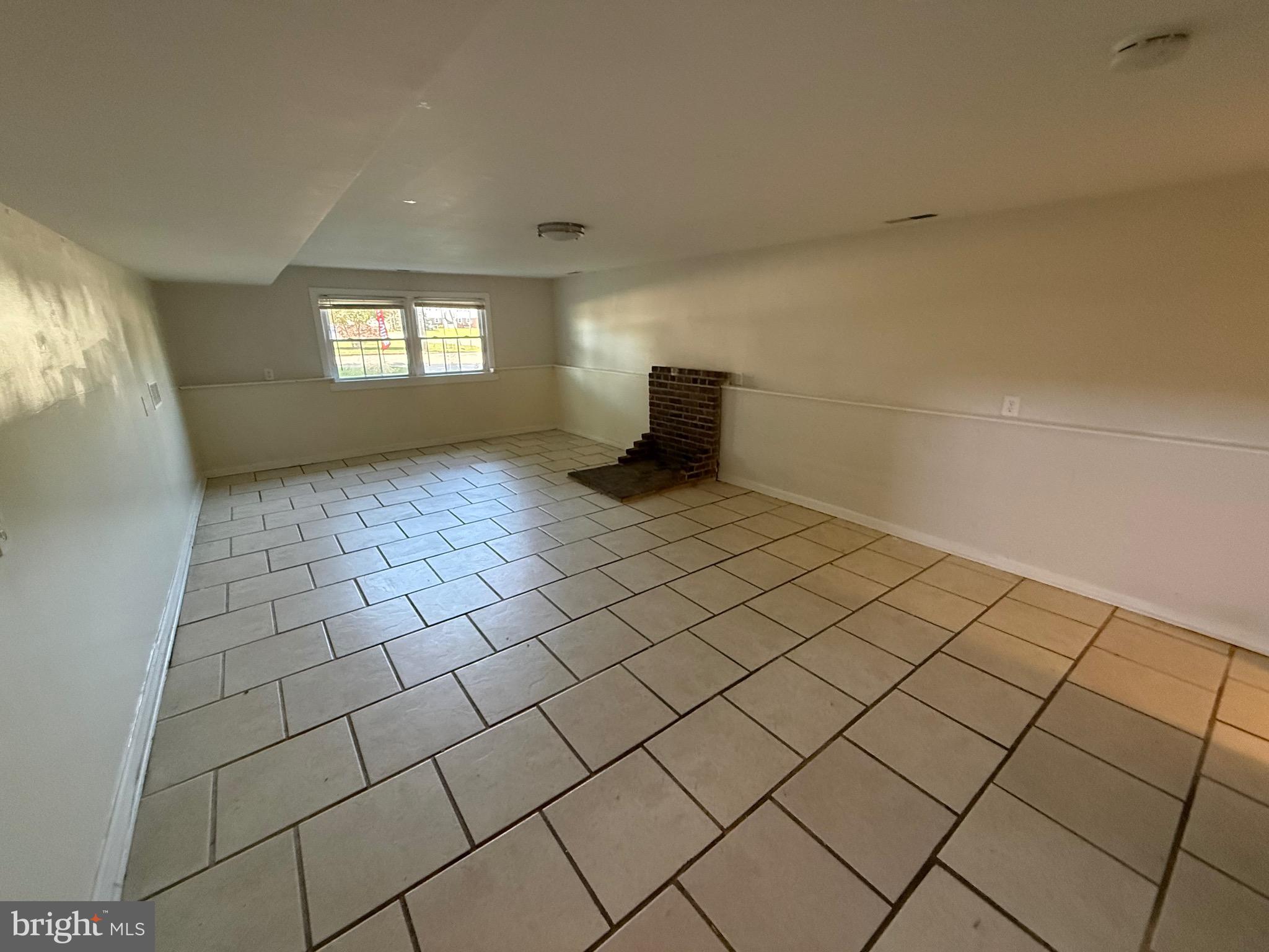 174 Kansas Road Pennsville, NJ 08070 - Photo 14 of 22 a view of an empty room and window