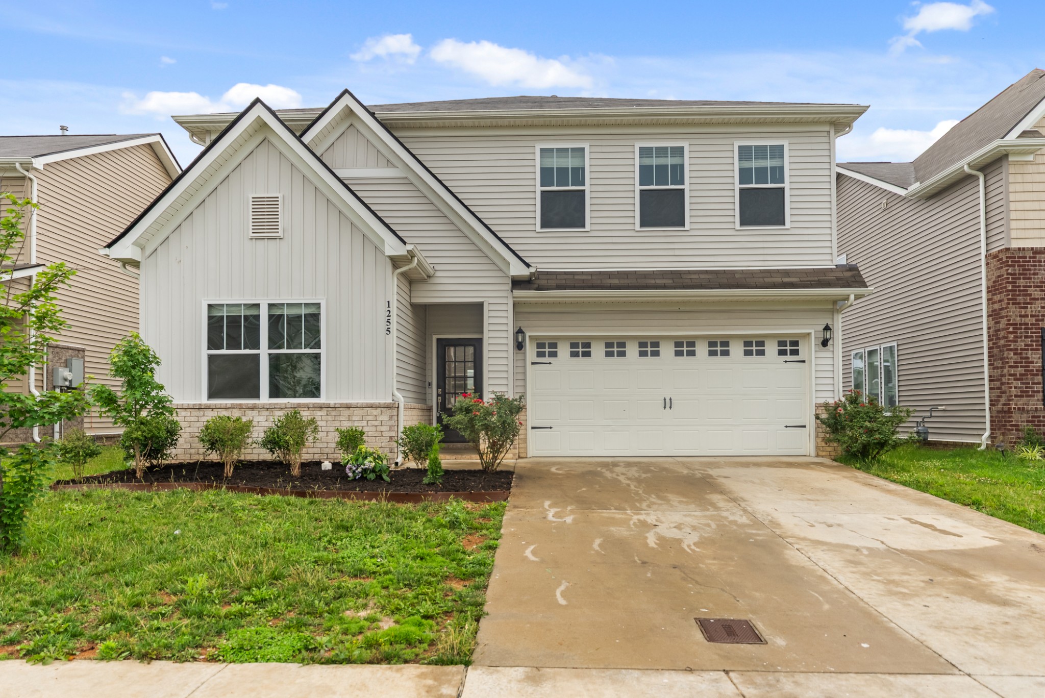 1255 Inverness Pass Lebanon, TN 37087 - Photo 4 of 40 a front view of a house with a yard and garage