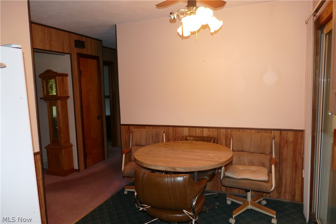 8661 Ravenna Road Chardon, OH 44024 - Photo 11 of 16 Living area featuring carpet flooring and ceiling fan