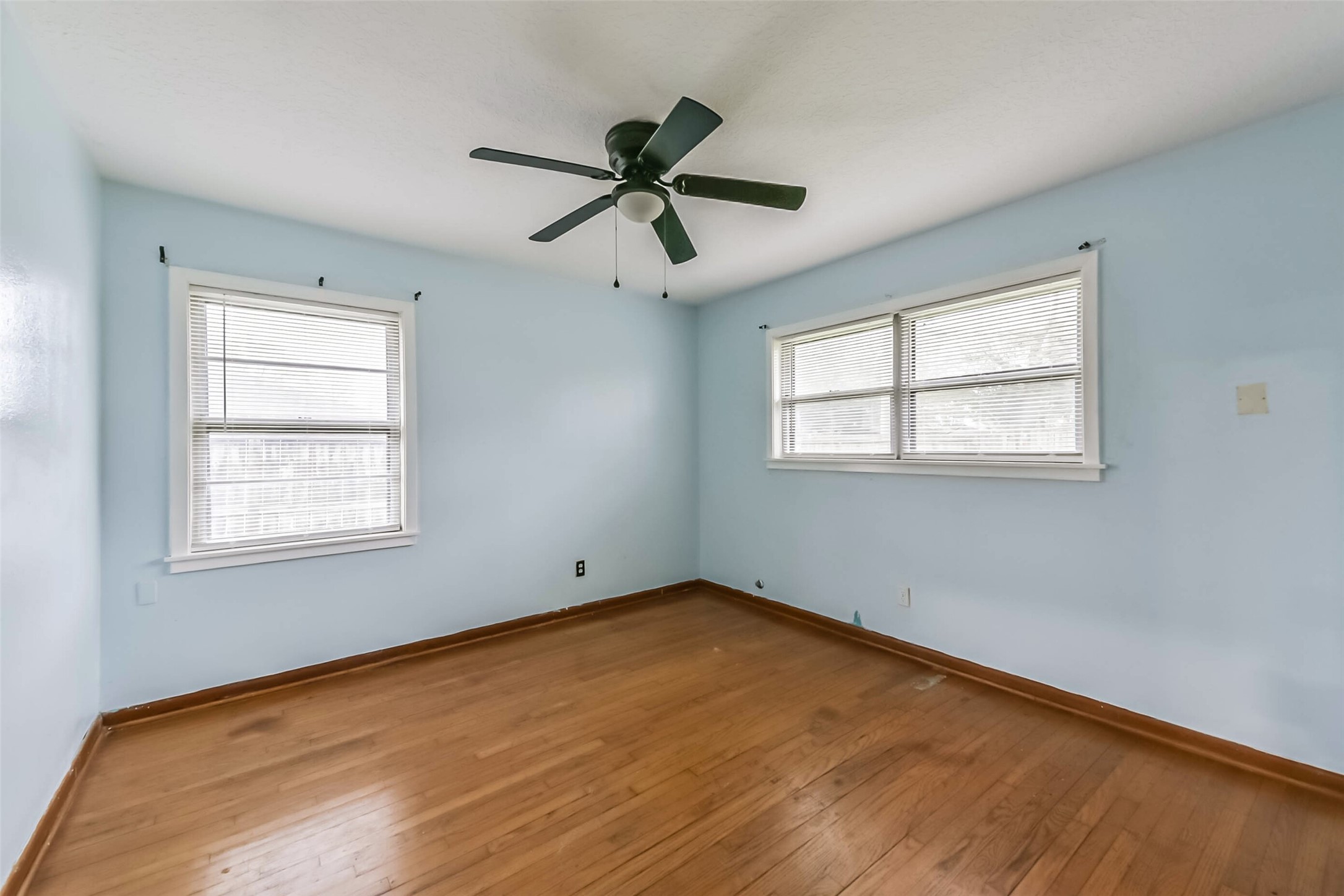 705 Dunwick Lane Pasadena, TX 77502 - Photo 24 of 27 a view of an empty room with a window and wooden floor