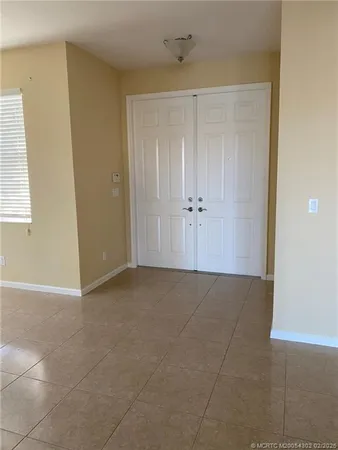 a view of an empty room and window