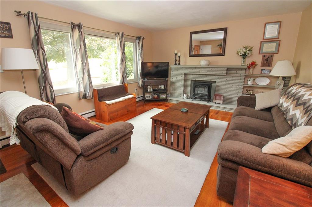 63 Beaver Grade Road McKees Rocks, PA 15136 - Photo 3 of 25 Living room with natural light and decorative fireplace!