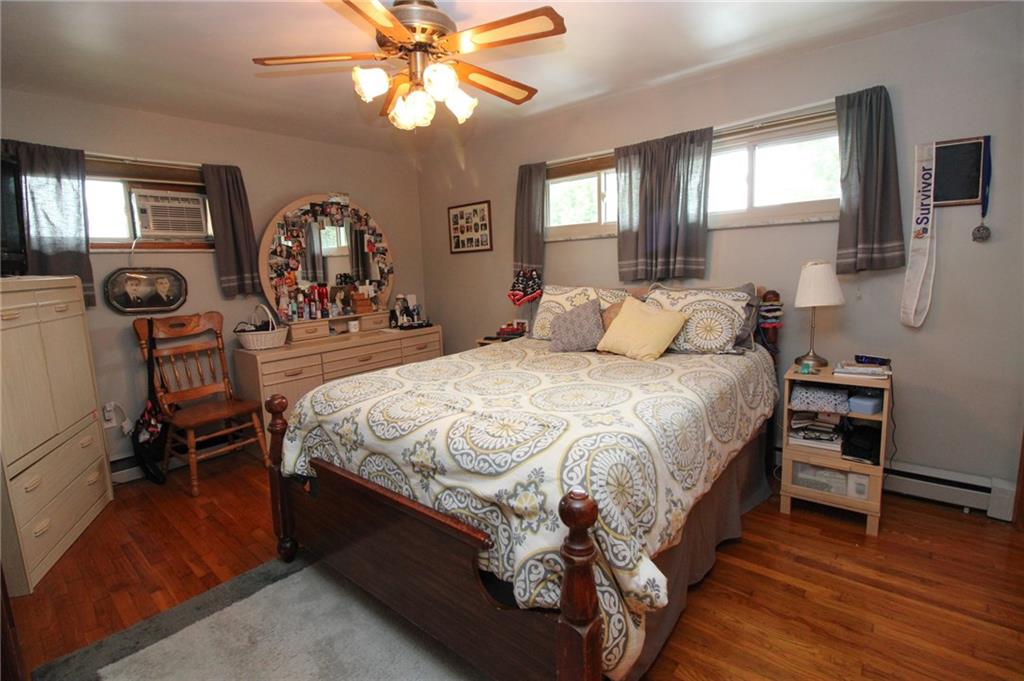 63 Beaver Grade Road McKees Rocks, PA 15136 - Photo 8 of 25 Main floor master bedroom features ceiling fan and hardwood floors!