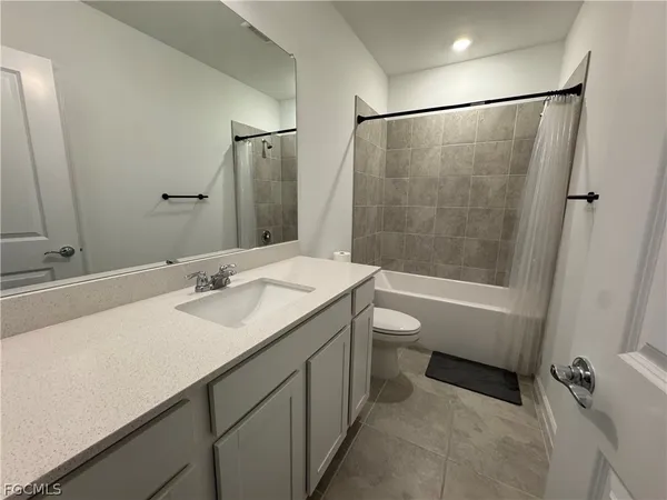 a view of an empty room and a window