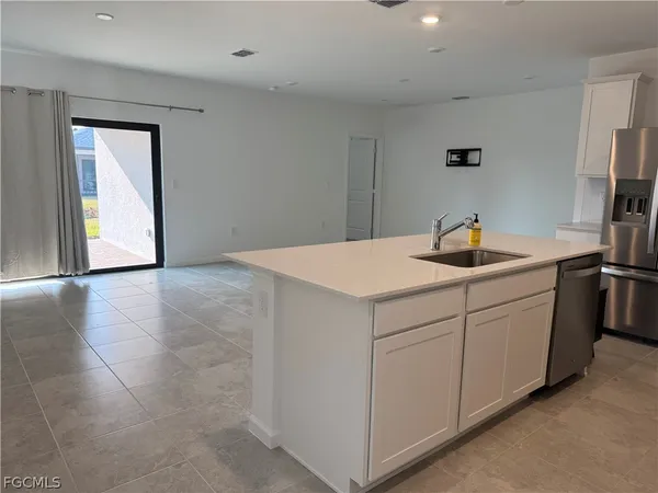 a kitchen with a sink and cabinets