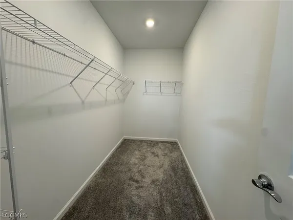 a view of a room with racks on the wall