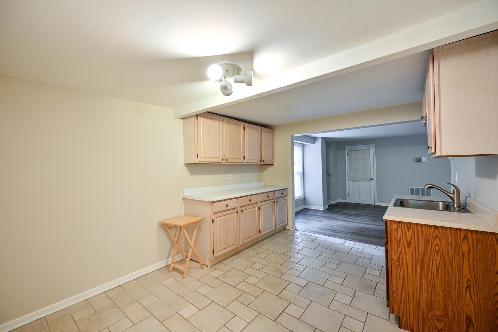 611 Saddle Road Wheaton, IL 60187 - Photo 14 of 21 a kitchen with granite countertop cabinets and sink