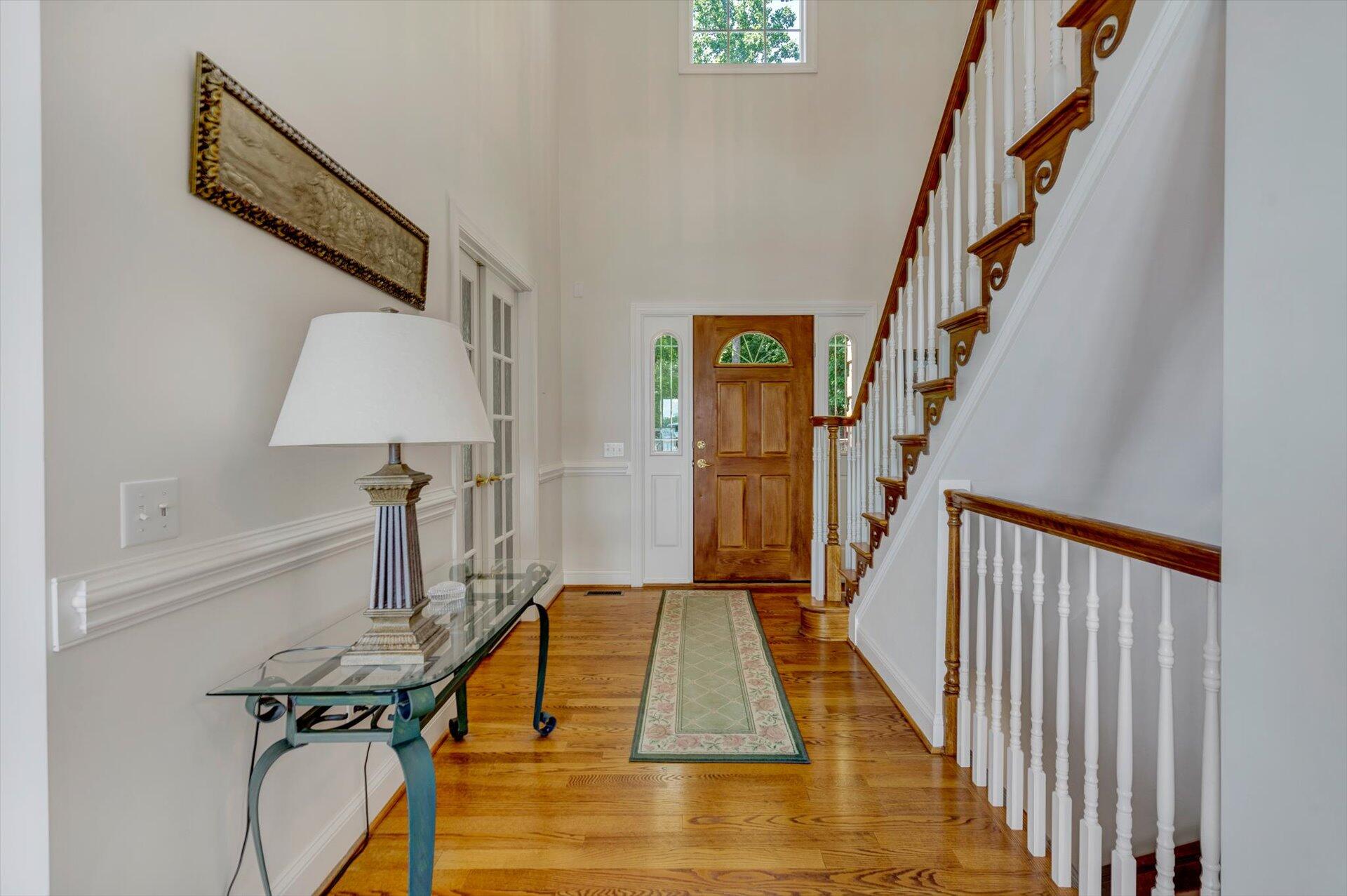 910 Somerset Cove Road Union Hall, VA 24176 - Photo 11 of 84 a view of a staircase with wooden floor and stairs