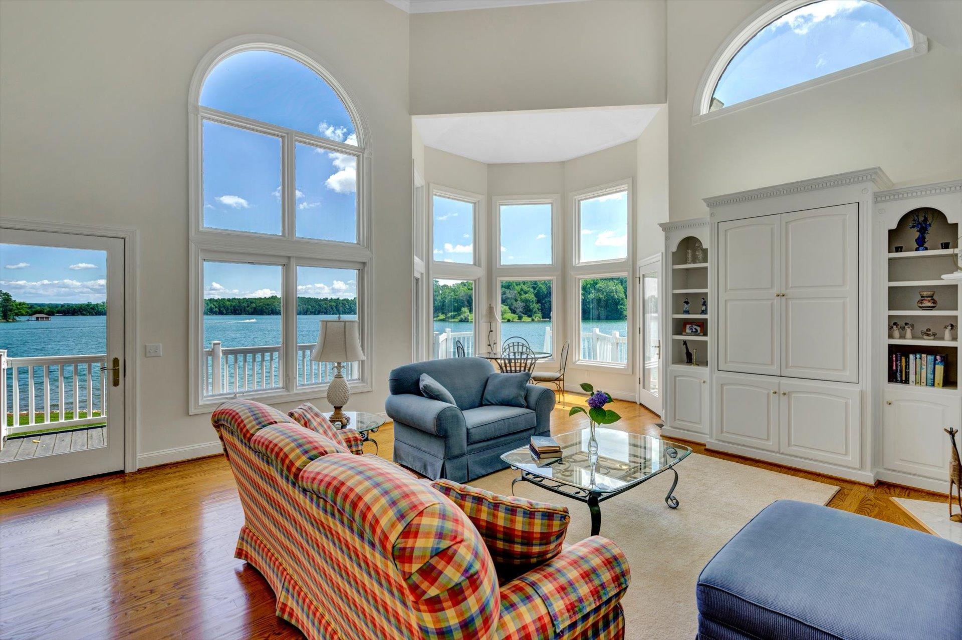 910 Somerset Cove Road Union Hall, VA 24176 - Photo 14 of 84 a living room with furniture and a floor to ceiling window