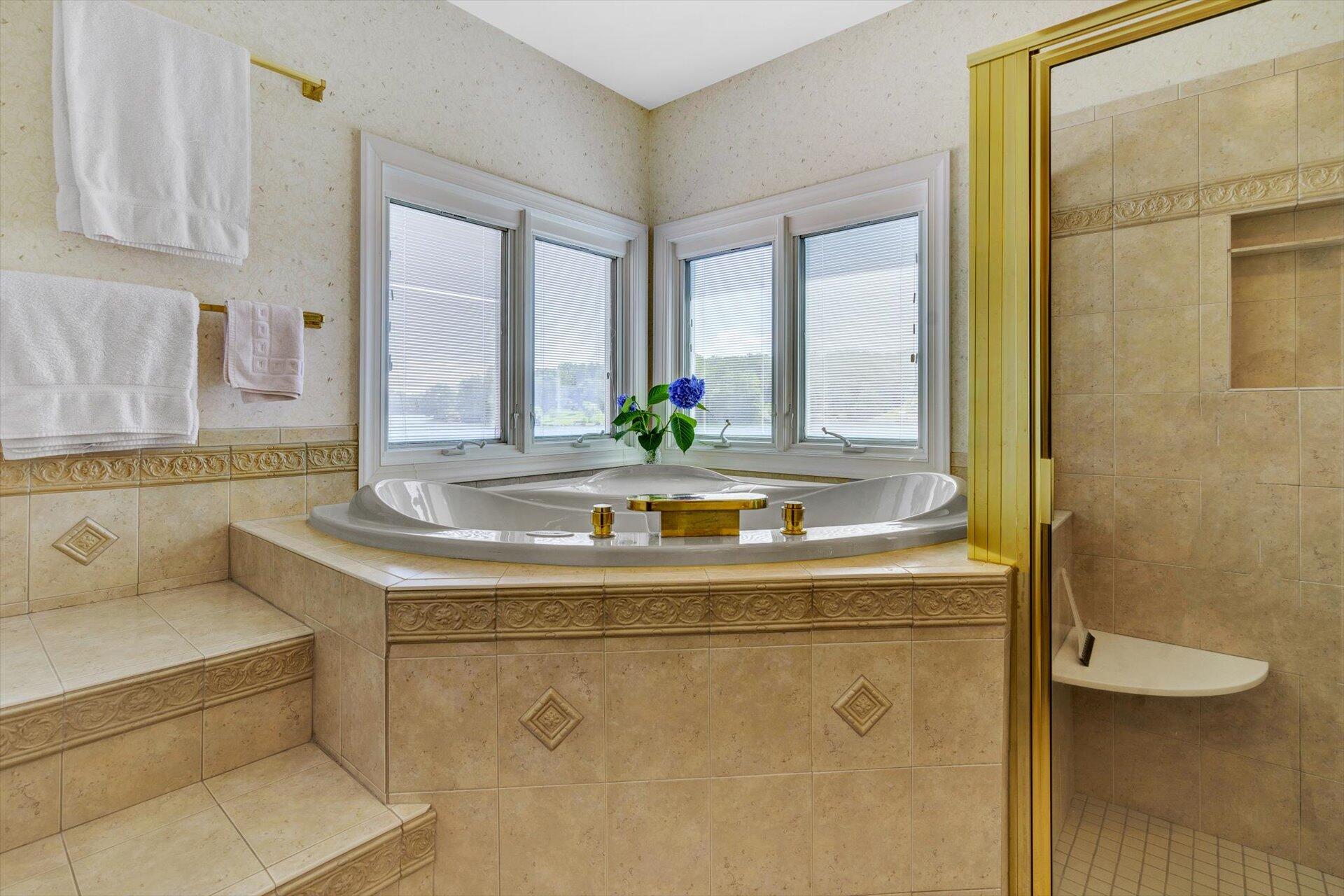910 Somerset Cove Road Union Hall, VA 24176 - Photo 36 of 84 a bathroom with a granite countertop sink a toilet and a large mirror