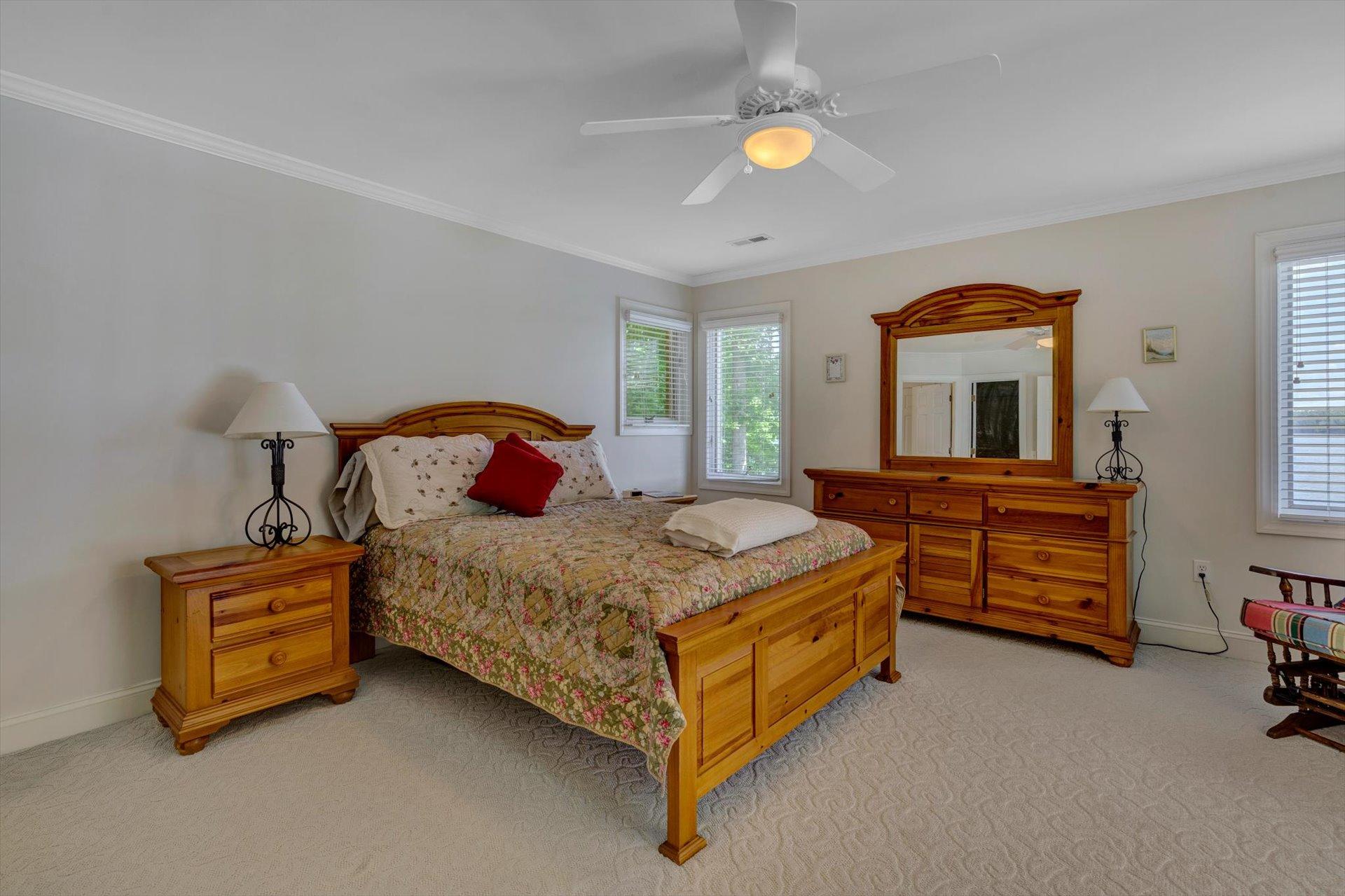 910 Somerset Cove Road Union Hall, VA 24176 - Photo 45 of 84 a bedroom with a bed and a chandelier