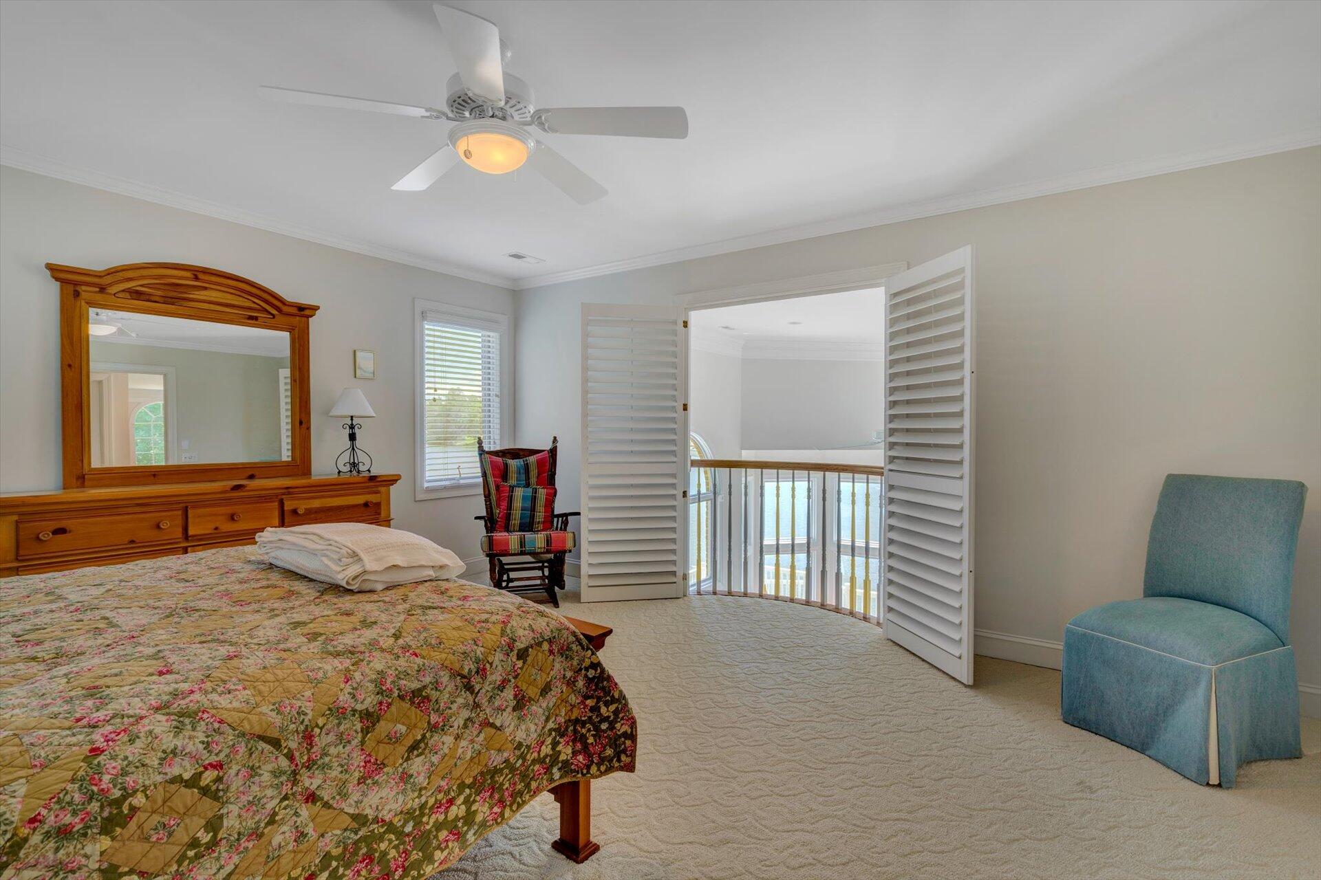 910 Somerset Cove Road Union Hall, VA 24176 - Photo 46 of 84 a bedroom with a bed and a chandelier