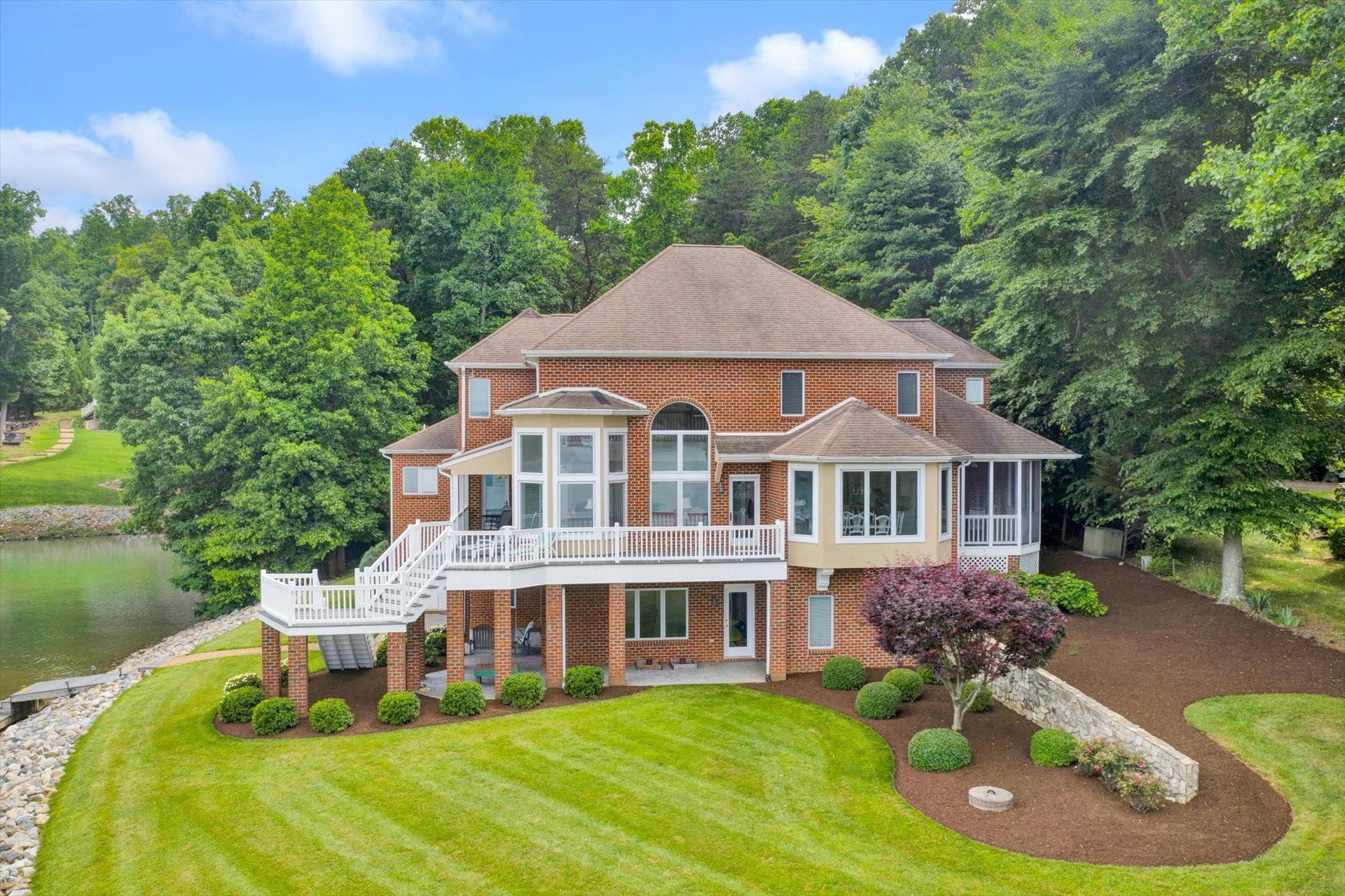 910 Somerset Cove Road Union Hall, VA 24176 - Photo 7 of 84 a aerial view of a house with a yard table and chairs