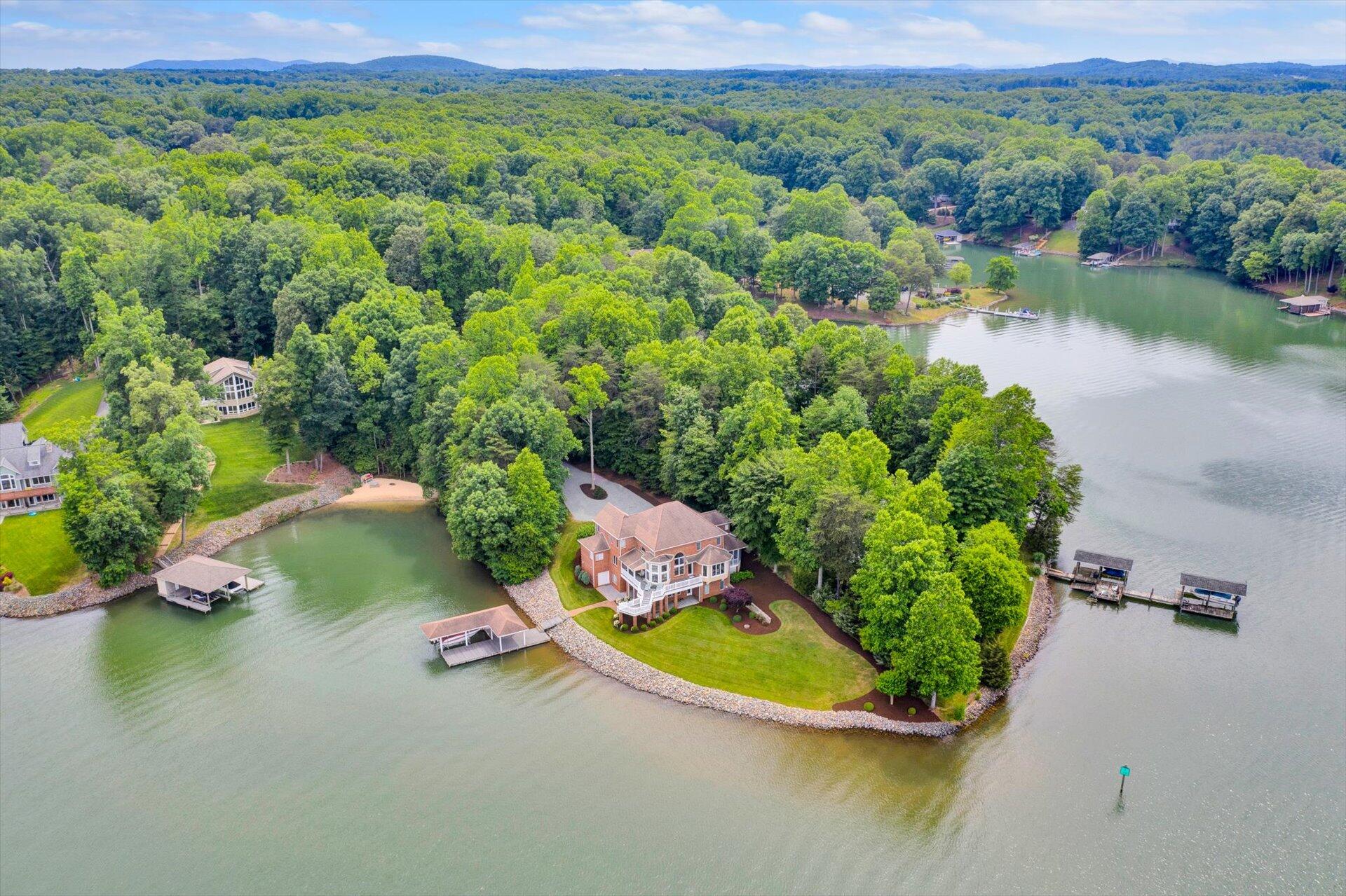 910 Somerset Cove Road Union Hall, VA 24176 - Photo 79 of 84 an aerial view of a house with a yard and lake