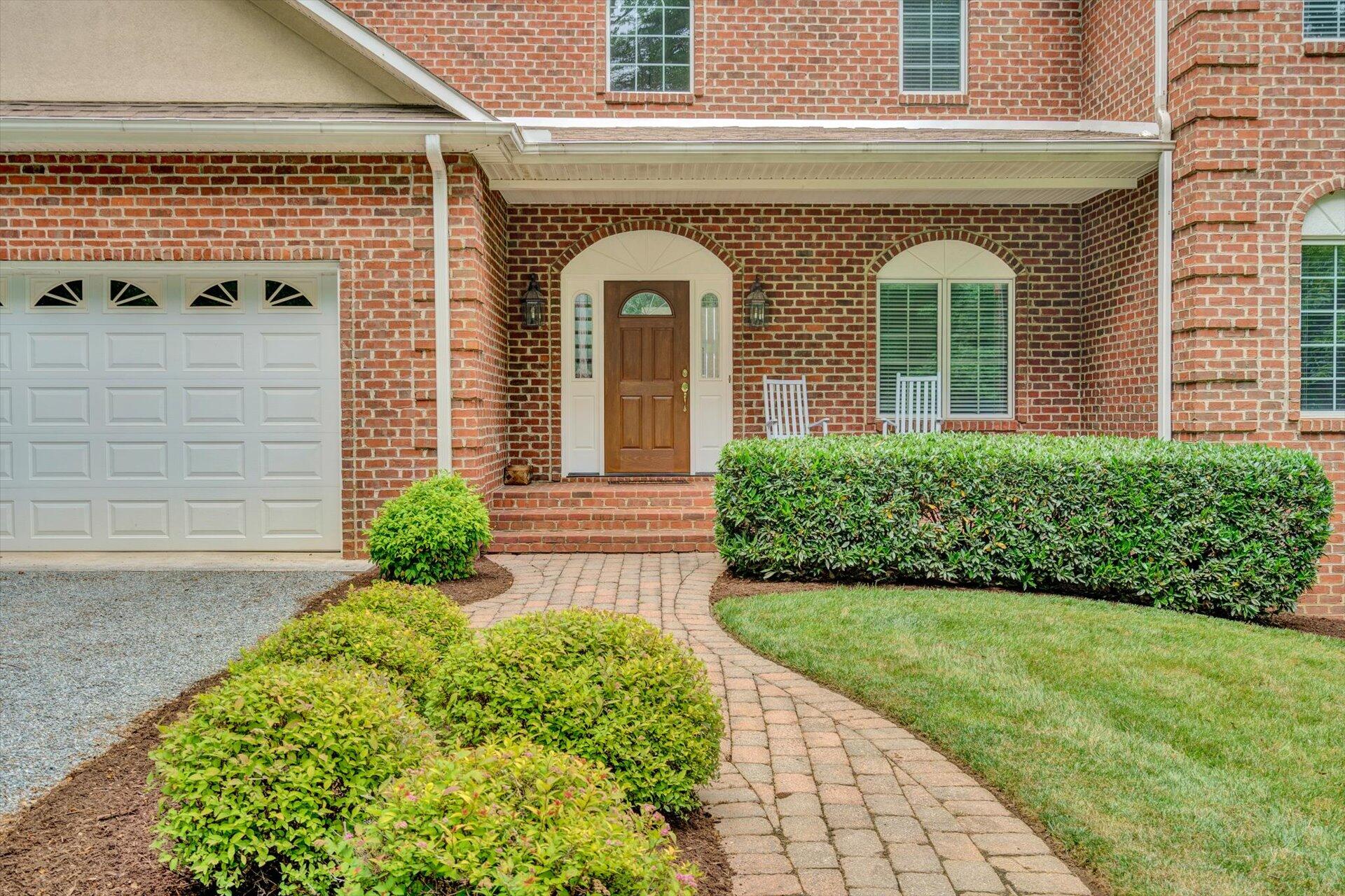 910 Somerset Cove Road Union Hall, VA 24176 - Photo 10 of 84 a front view of a house with garden