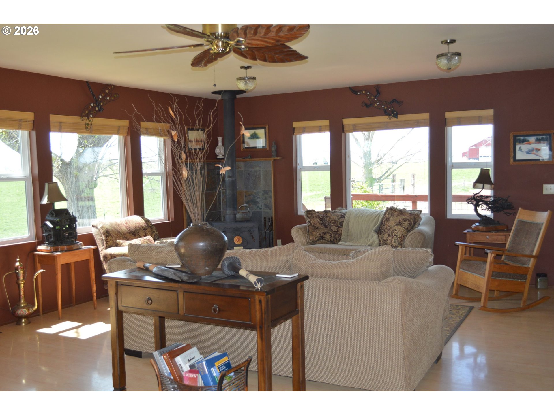 1935 Bench Road Vale, OR 97918 - Photo 12 of 25 a living room with furniture a flat screen tv and a floor to ceiling window