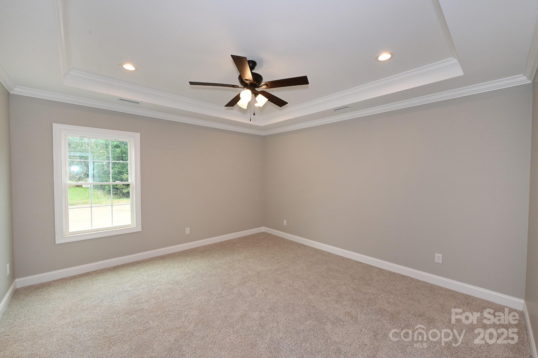 3835 Sulphur Springs Road Northeast Hickory, NC 28601 - Photo 25 of 44 an empty room with windows and fan