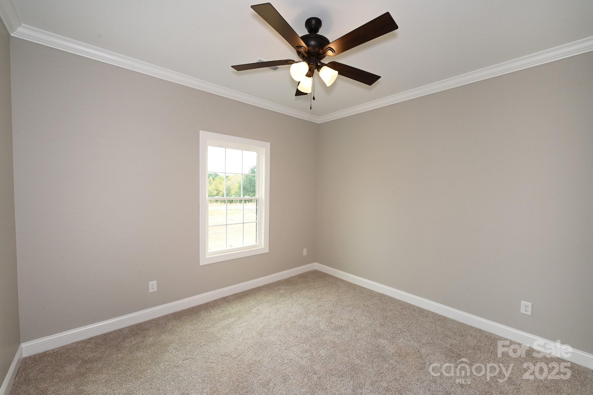 3835 Sulphur Springs Road Northeast Hickory, NC 28601 - Photo 36 of 44 an empty room with a window and a fan