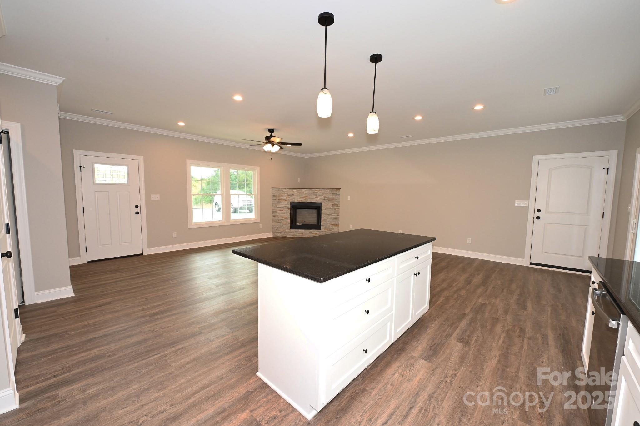 3835 Sulphur Springs Road Northeast Hickory, NC 28601 - Photo 9 of 44 a kitchen with a stove and a wooden floor