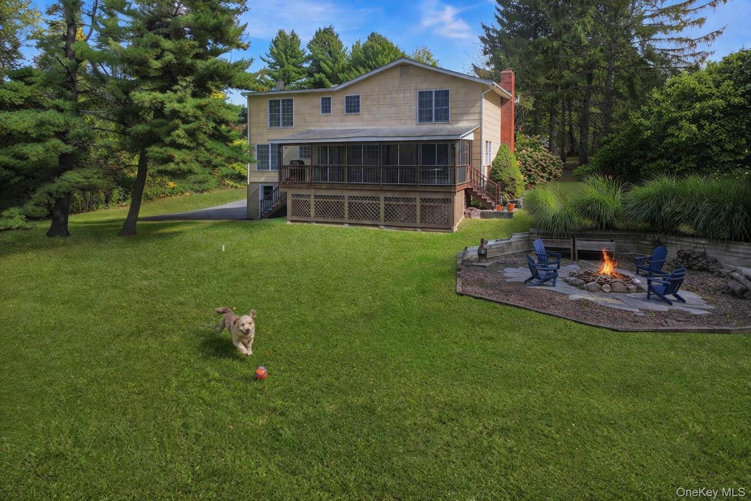 5 Elena Road Campbell Hall, NY 10916 - Photo 4 of 40 Dog and Fire in Fire Pit (AI Generated/Virtual Staging). Owner does not have a dog