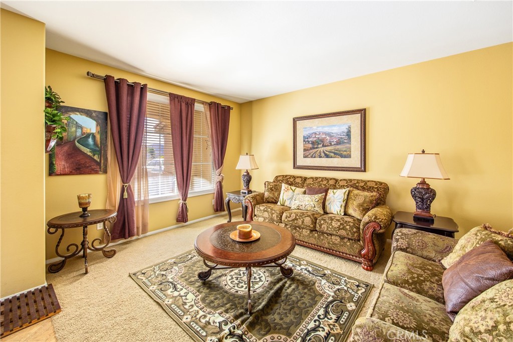 18936 Malkoha Street Perris, CA 92570 - Photo 12 of 70 a living room with furniture and a window