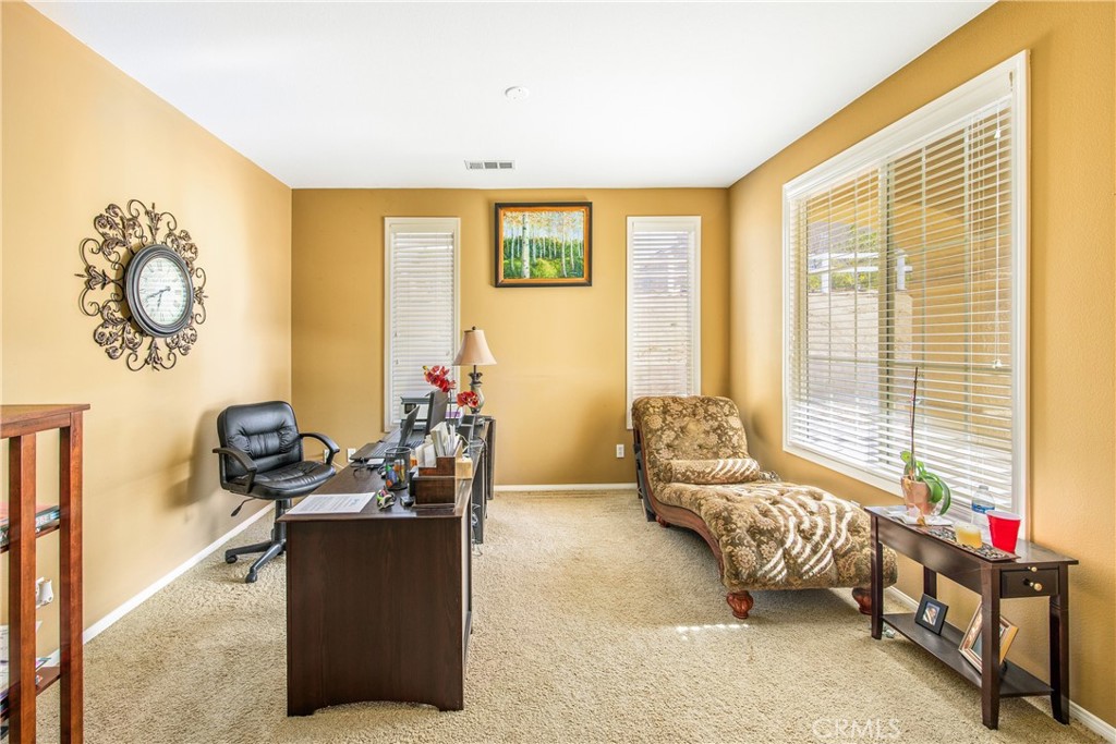 18936 Malkoha Street Perris, CA 92570 - Photo 14 of 70 a living room with furniture and a window