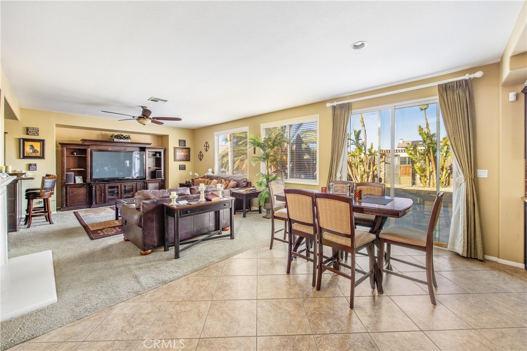 18936 Malkoha Street Perris, CA 92570 - Photo 16 of 70 a living room with furniture and a large window