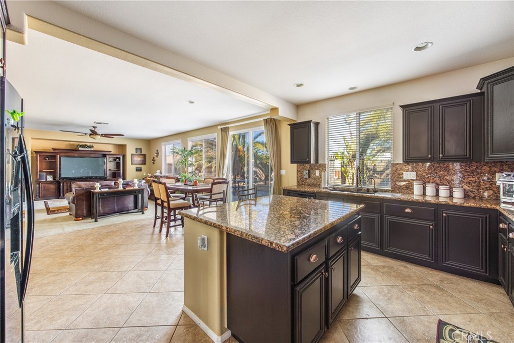 18936 Malkoha Street Perris, CA 92570 - Photo 20 of 70 a kitchen with a sink counter top space and appliances