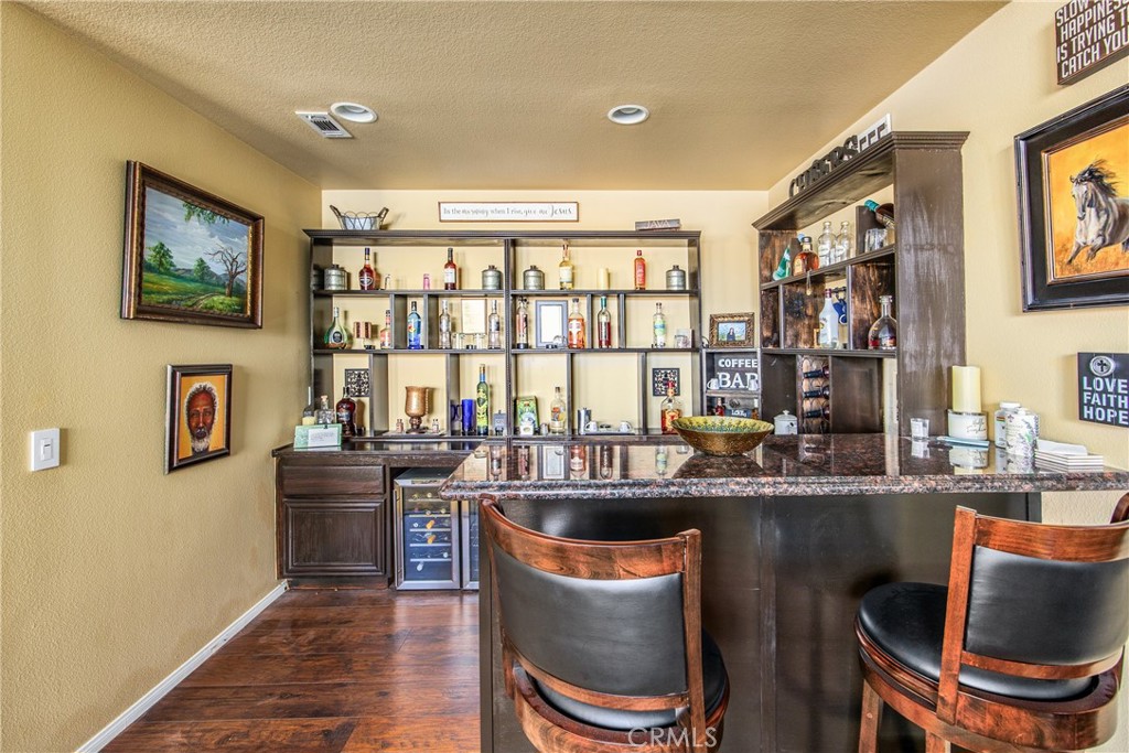 18936 Malkoha Street Perris, CA 92570 - Photo 25 of 70 a kitchen with a table and chairs