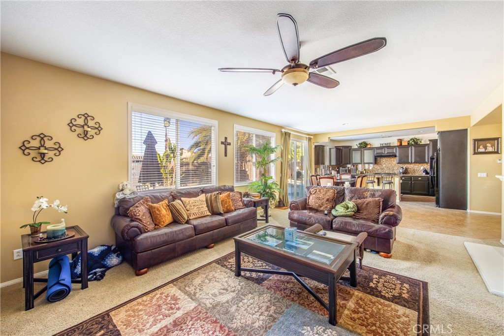 18936 Malkoha Street Perris, CA 92570 - Photo 26 of 70 a living room with furniture and a window