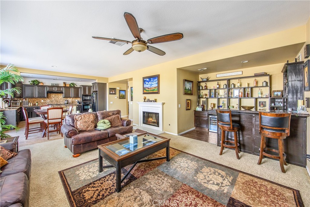 18936 Malkoha Street Perris, CA 92570 - Photo 27 of 70 a living room with furniture wooden floor and a window