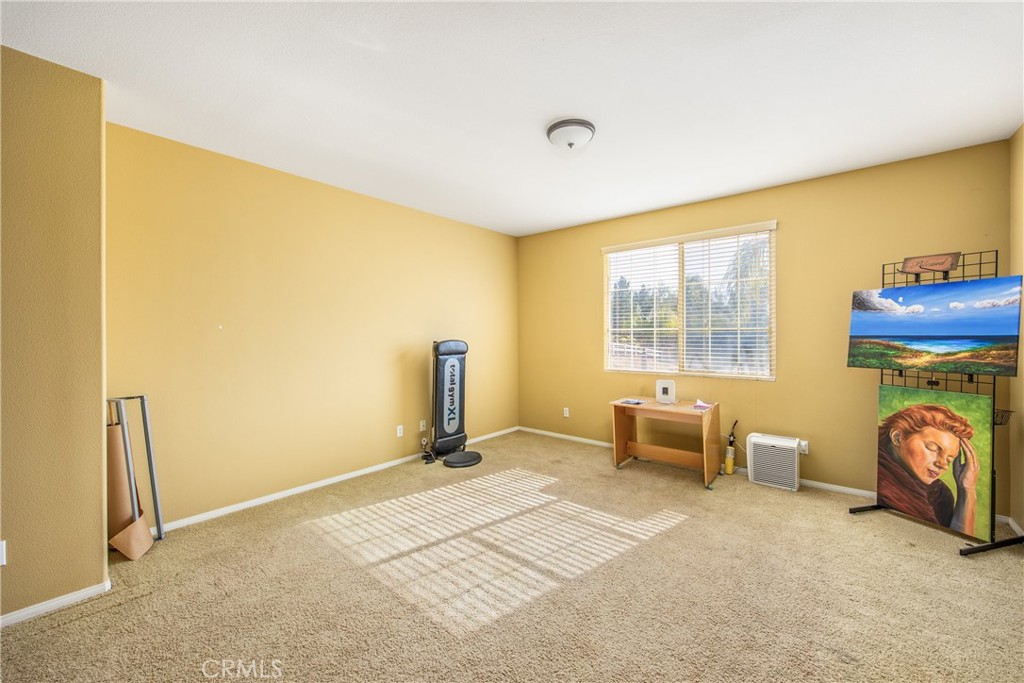 18936 Malkoha Street Perris, CA 92570 - Photo 31 of 70 a view of a room with furniture and a window