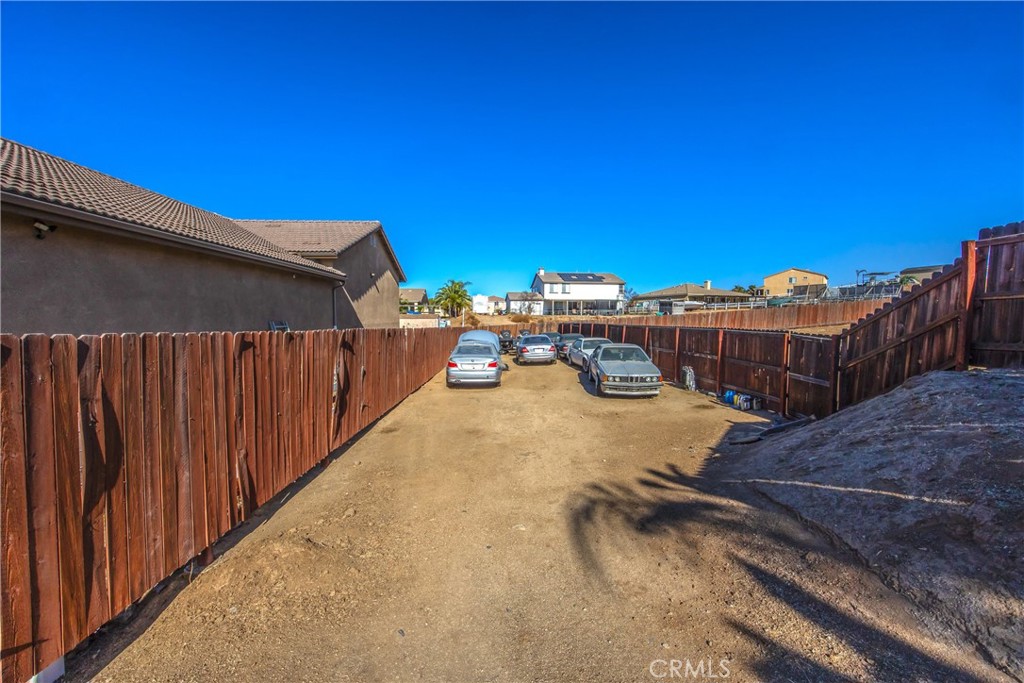 18936 Malkoha Street Perris, CA 92570 - Photo 53 of 70 a view of a patio with wooden fence