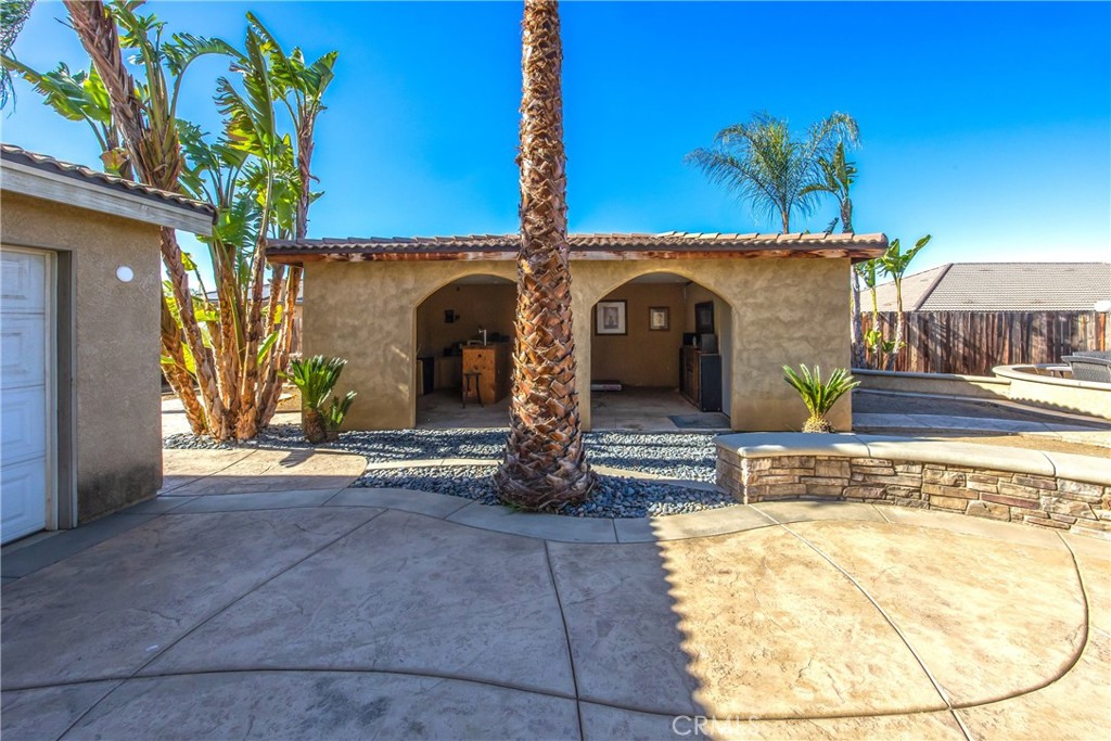 18936 Malkoha Street Perris, CA 92570 - Photo 68 of 70 a front view of a house with a garden