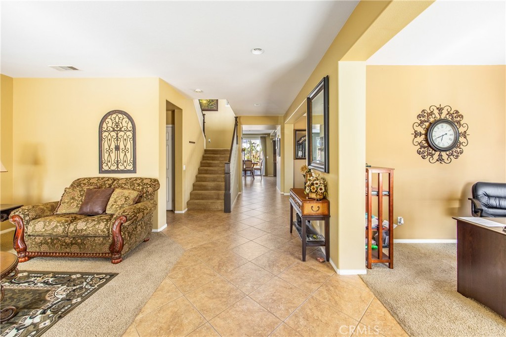18936 Malkoha Street Perris, CA 92570 - Photo 10 of 70 a living room with furniture a couch and a table