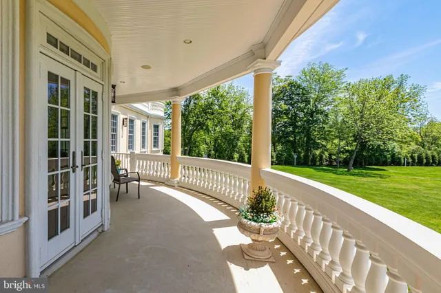 a kitchen with stainless steel appliances granite countertop a kitchen island a stove a table and chairs in it