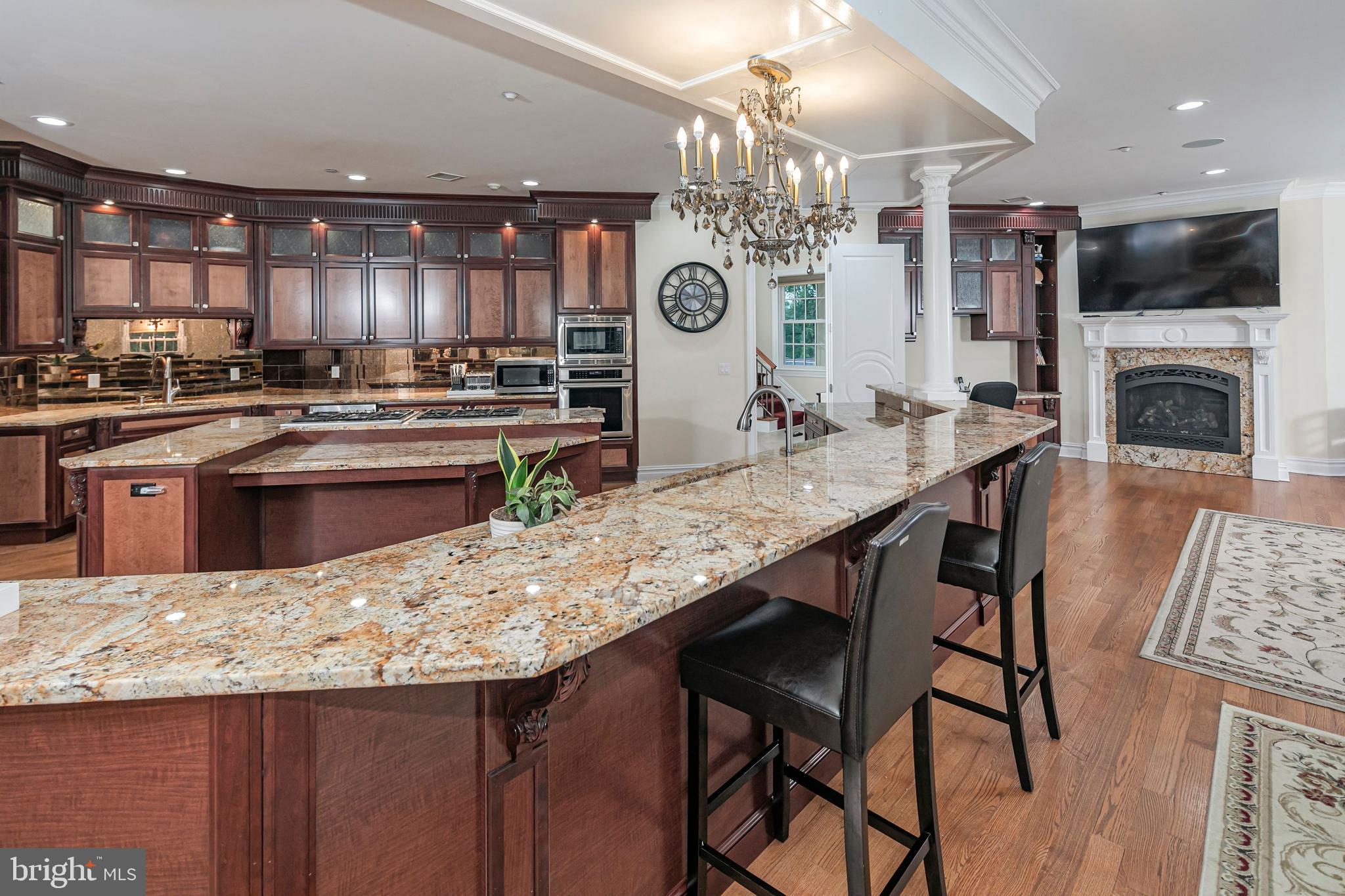 3870 Princeton Pike Lawrenceville, NJ 08648 - Photo 20 of 57 a kitchen with stainless steel appliances granite countertop a kitchen island a stove a table and chairs in it