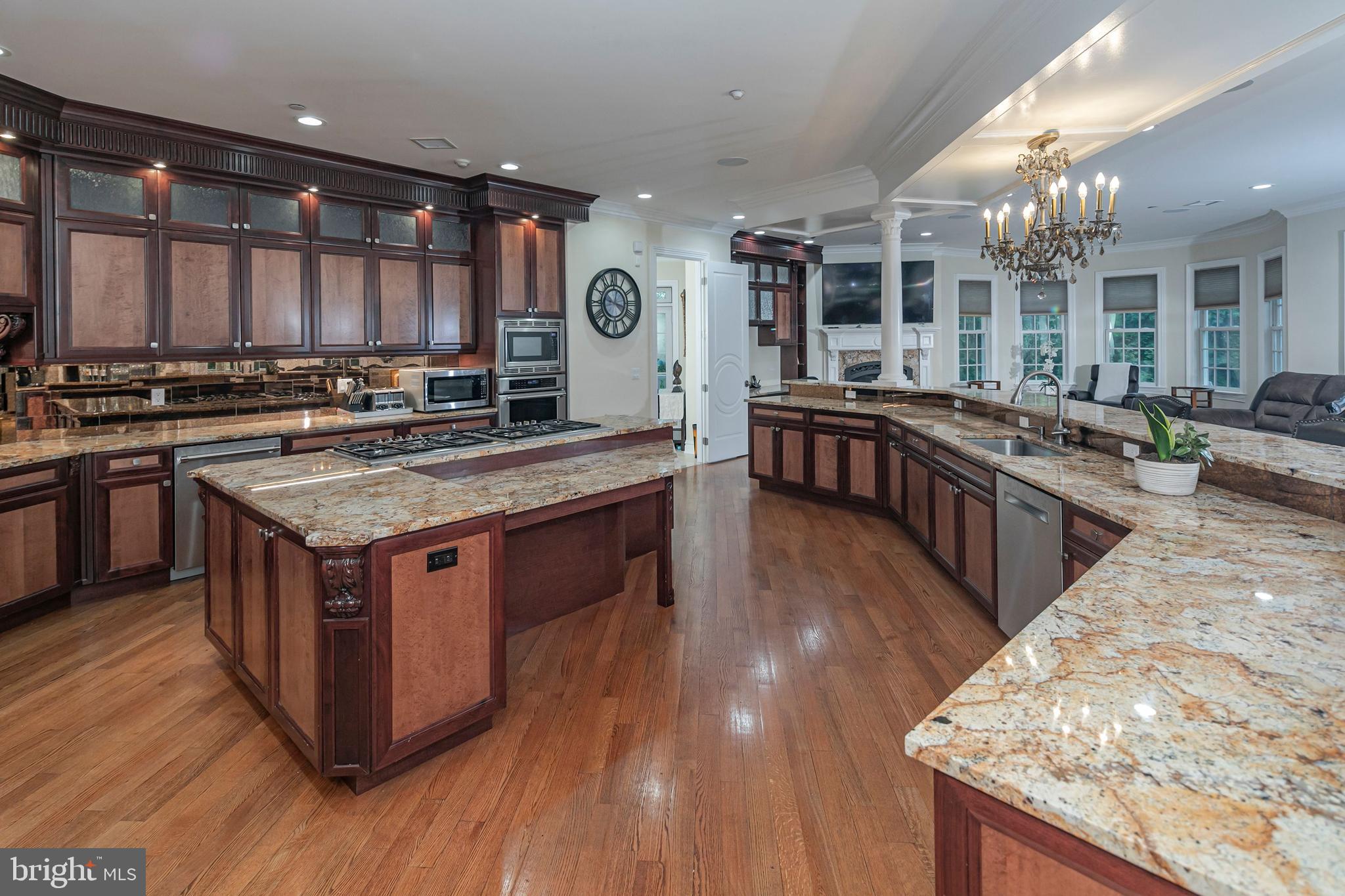 3870 Princeton Pike Lawrenceville, NJ 08648 - Photo 22 of 57 a kitchen with stainless steel appliances granite countertop a stove and a wooden floors