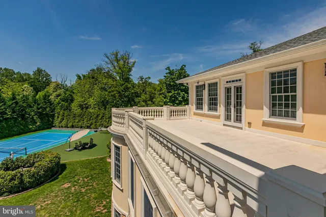 a spacious bedroom with a large bed and a fireplace