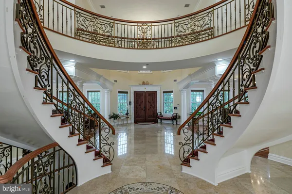 a living room with a flat screen tv and gym equipment