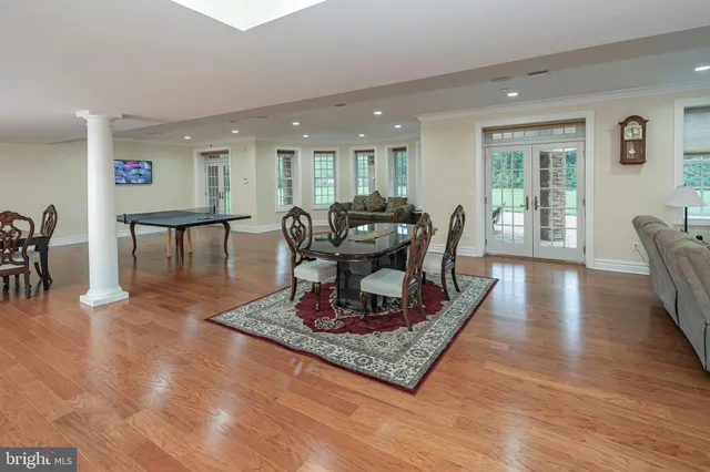 a spacious bedroom with a bed and a flat screen tv