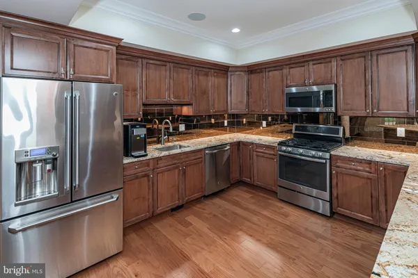 a front view of a house with a yard and outdoor seating