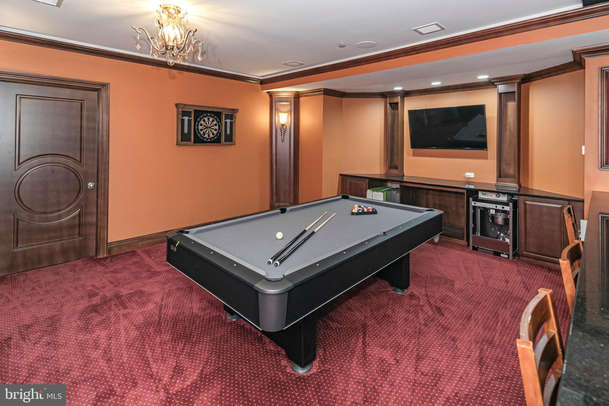 3870 Princeton Pike Lawrenceville, NJ 08648 - Photo 46 of 57 a living room with a flat screen tv and gym equipment