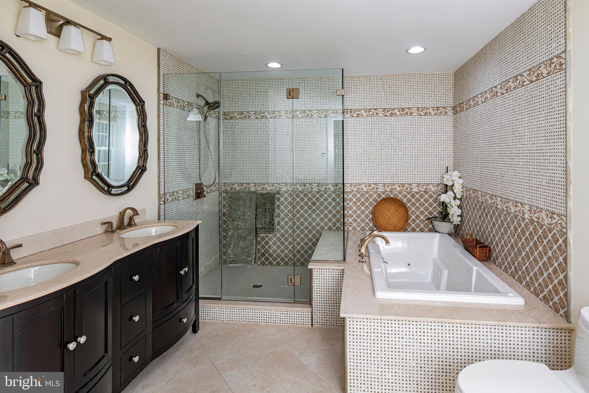 3870 Princeton Pike Lawrenceville, NJ 08648 - Photo 49 of 57 a bathroom with a sink mirror and tub