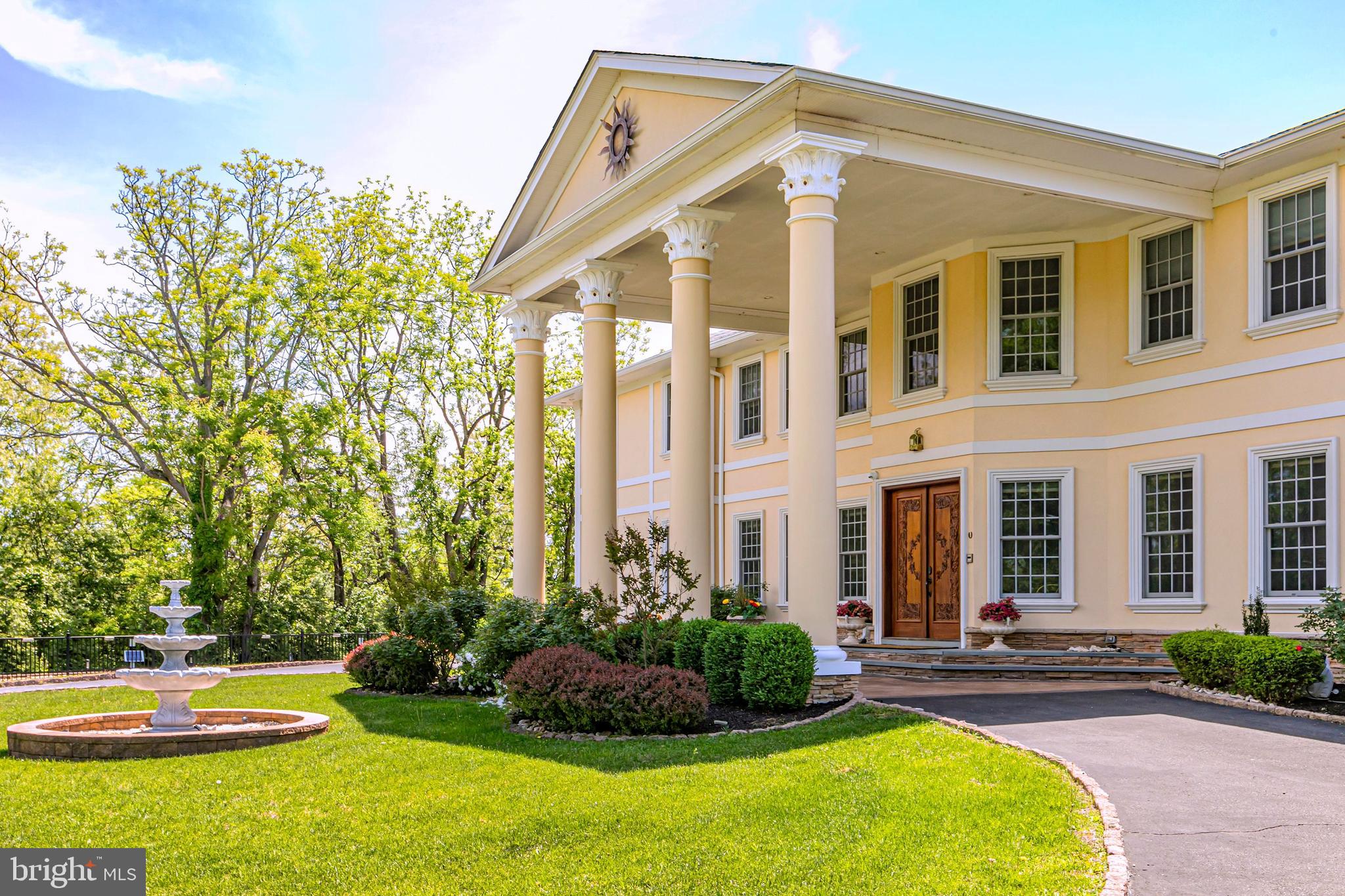 3870 Princeton Pike Lawrenceville, NJ 08648 - Photo 7 of 57 a front view of a house with a yard table and chairs
