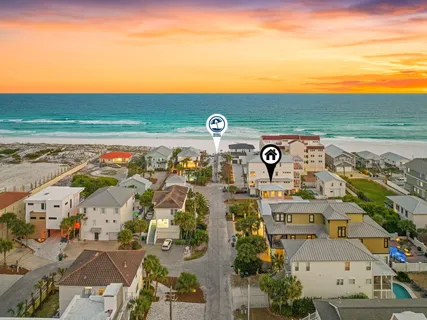 an aerial view of multiple houses with outdoor space