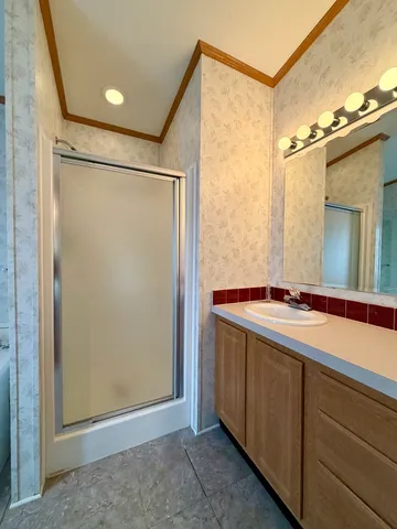 a bathroom with a double vanity sink and mirror