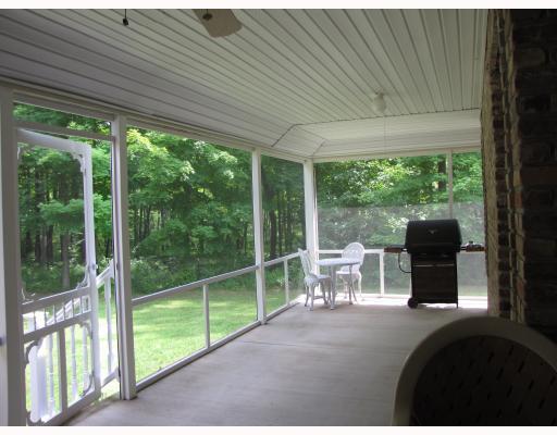 133 County Line Road Harrisville, PA 16038 - Photo 13 of 15 Patio/Deck. Screened in wrap around rear porch