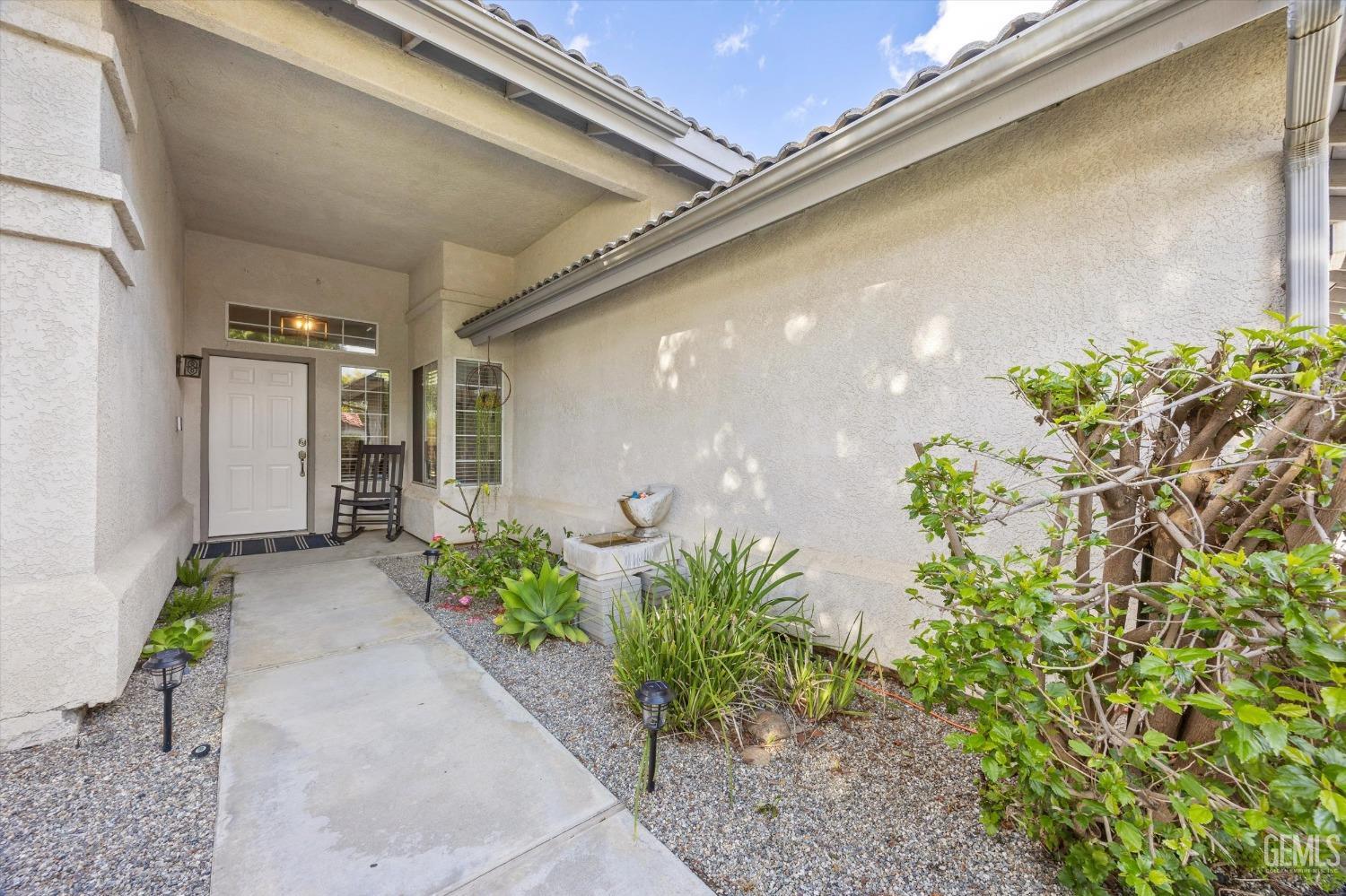 Undisclosed Address Bakersfield, CA 93312 - Photo 5 of 31 a view of a path along with potted plant